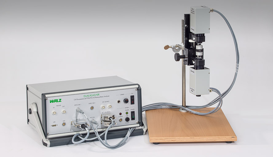 DUAL-KLAS-NIR control unit (DKN-C) left with the emitter and detector units held by the Linear Positioning System in the vertical position on the right hand side.
