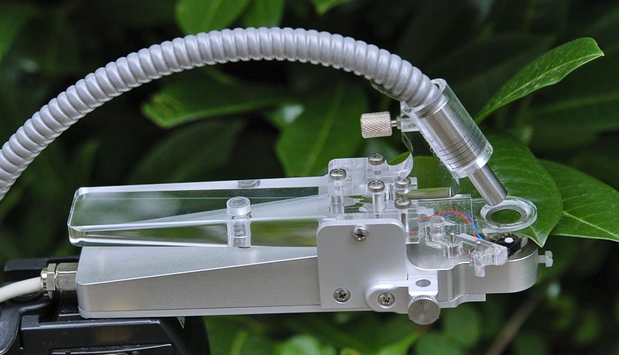 PAM-2500 accessory for field measurements: Light and temperature-sensing leaf clip (type 2030-B) on tripod.