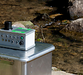 Rear view of the WATER-PAM-II showing ports and compact housing design