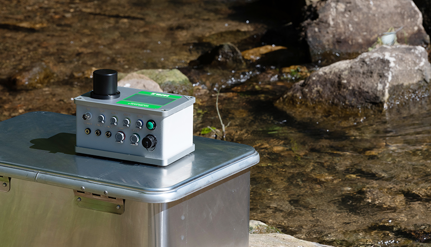 Rear view of the WATER-PAM-II showing ports and compact housing design