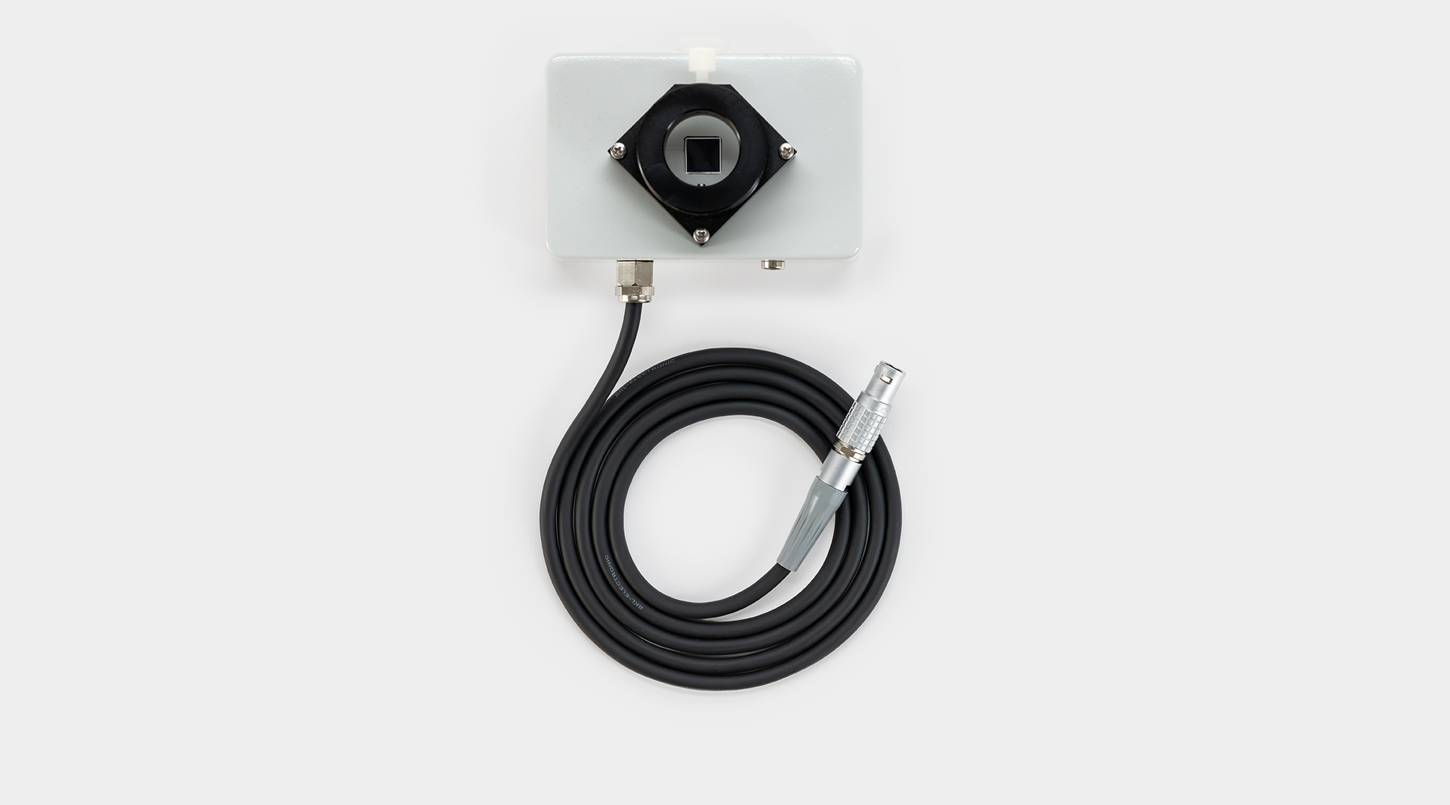 DUAL-DPD high-sensitivity fluorescence detector with black anodised C-mount housing, circular optical aperture, coiled black cable with Lemo connector and RG 665 longpass emission filter