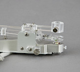 90° fiberoptics adapter attached to leaf clip showing acrylic optical components, spring-loaded mechanism, circular sensor window with LED elements and aluminium mounting frame