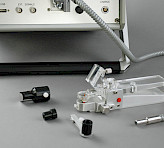 Accessories for DUAL-PAM/F. From left to right: Leaf holder of DUAL-BA accessory, fiber optics adapter DUAL-A, leaf clip DUAL-LC and leaf clip 2030-B.