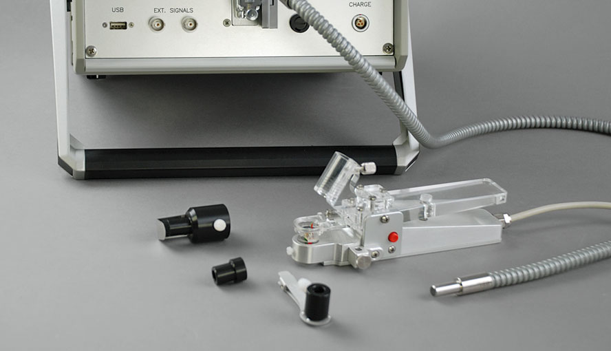 Accessories for DUAL-PAM/F. From left to right: Leaf holder of DUAL-BA accessory, fiber optics adapter DUAL-A, leaf clip DUAL-LC and leaf clip 2030-B.